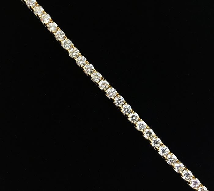 Tennis Bracelet with 34 diamonds equaling 14.59 carat total weight. Mounted in 18 karat yellow gold. I, J color. SI clarity. $16,500.