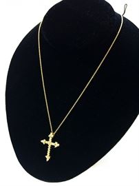 Diamond Cross .70 carat total weight in 14 karat yellow gold with chain. $600