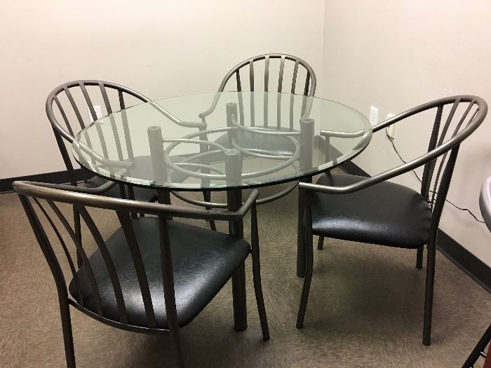Dining room table and 4 chairs. 42" diameter. Glass has some light scratches. Chairs are perfect. $200.