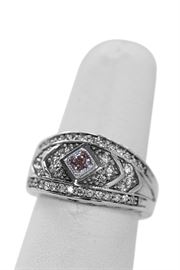Pink Diamond in center .23 carat. Surrounded by .83 total weight in G color, VS clarity diamonds. 14 karat white gold.  $920