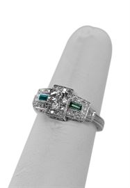 Art Deco diamond ring with emeralds.  Approximately 2/3 carat center. Surrounded by 1/3 carat total weight.  $1500.