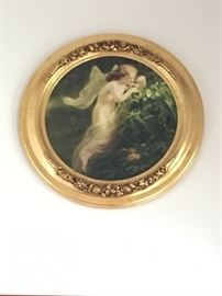 there are a pair of these round framed angel prints