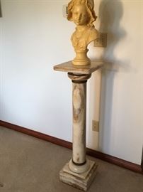 Marble pedestal with rotating top.  Bust sculpture