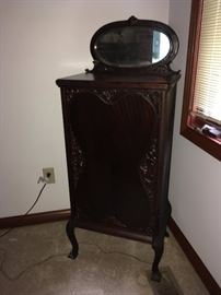 Mirrored music cabinet in dark mahogany
