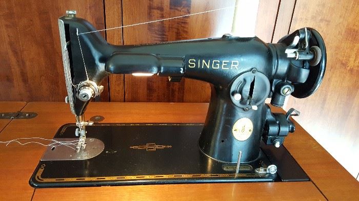 1947 Singer Model 201-2 with accessories and cabinet. Works well and is in great condition.