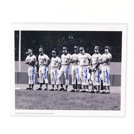 "The Big Red Machine" Fuji Crystal Photograph Signed by Pete Rose, Johnny Bench, Ken Griffey, and more: A “Great Eight” signed Fuji crystal archival photograph titled The Big Red Machine. It depicts Pete Rose, Ken Griffey, Joe Morgan, Tony Perez, George Foster, Johnny Bench, Cesar Geronimo, and David Concepcion, all with their respective autographs signed in blue marker. The image is marked with an International Photo Archives logo. Comes in a plastic sleeve with a Classic Moments certificate of authenticity, as well as a collage of each player signing the photograph.