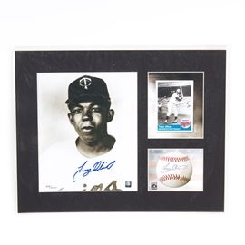 Tony Oliva Signed Minnesota Twins Lithograph: A Tony Oliva signed Minnesota Twins lithograph. It features an official MLB hologram-stamped image of Oliva that has been hand signed by the player, an image of his baseball card, and an image of a baseball with a facsimile signature. All three are set in a black, partitioned matting and protected by a clear plastic sleeve. This piece is numbered 438/5000 and includes Toon Art Inc. and Classic Moments certificates of authenticity.