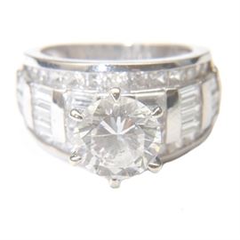 14K White Gold Ring With Clear Stones: A 14K white gold ring with clear, man-made stones.