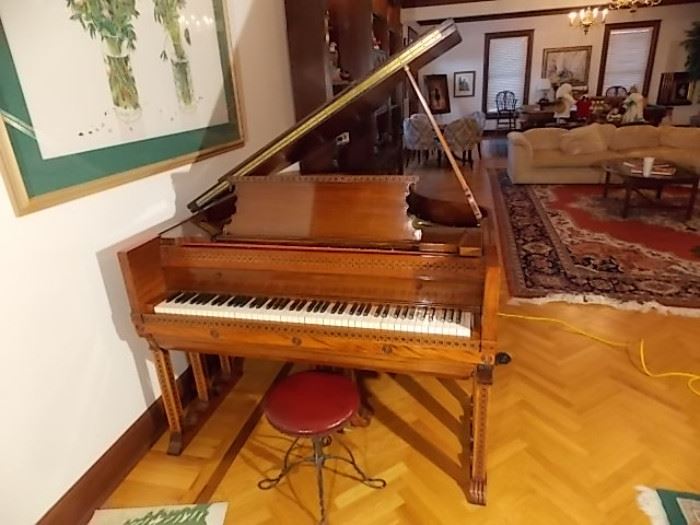 Fischer player baby grand piano, 9 legged, 5'4" and twisted wrought iron base piano stool.