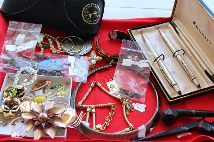 Costume jewelry, pens and small items.