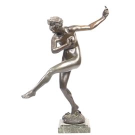 Maurice Guiraud-Rivière Bronze Sculpture "Bacchante": A bronze sculpture by Maurice Guiraud-Rivière (French, 1881–1947), titled Bacchante. The Neoclassical work depicts a female nude with a wide-eyed expression dancing with grapes at her feet and in a crown on her head. Signed in mold “Guiraud-Riviere” toward the front of the base. The bronze includes a foundry seal from Etling, Paris. Mounted on a marble base.