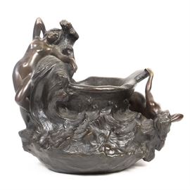 Emmanuel Villanis Art Nouveau Bronze Jardinière: A bronze jardinière by Emmanuel Villanis (French, 1858-1914). This sculptural Art Nouveau piece features two female nudes lounging on rocks and waves around the vessel. Imprinted “E. Villanis” to the back.