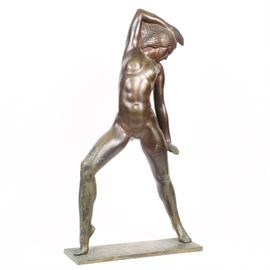 Nagy Bronze Sculpture "Young Dancer": A bronze sculpture by artist Nagy, titled Young Dancer. The Art Deco style work, possibly the work of Franz Nagy, depicts a female nude with stylized waves in her hair in a dance pose with right knee bent and right arm draped over her head, her gaze downward. The bronze is titled, dated 1937 and signed “3 Nagy 7” to the base.