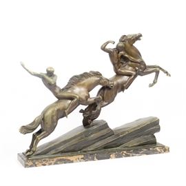 Armand Lemo Bronze Sculpture "Chasseurs à Cheval": A bronze sculpture by Armand Lemo (French, 1881-1936), titled Chasseurs à Cheval. This Art Deco style bronze depicts two male archers on horseback, the horses leaping on an ascent of rocks. Signed in mold “LEMO.” Mounted on a marble base.