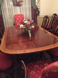 Gorgeous inlaid wood dining set.  Includes 12 chairs