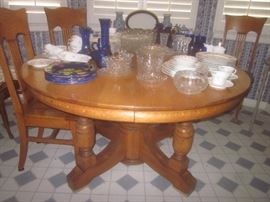 ROUND OAK DINING TABLE & CHAIRS.  HAVILAND CHINA, COBALT GLASS & FOSTORIA'S "AMERICAN"