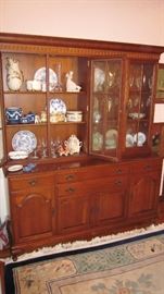 LARGE CHERRY CHINA CABINET FILLED WITH TREASURES