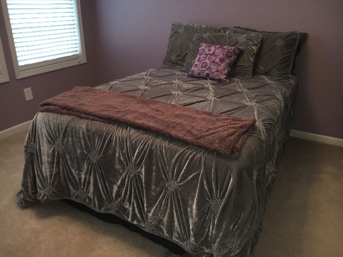 Full-size bed with frame (full or queen) and bed linens.