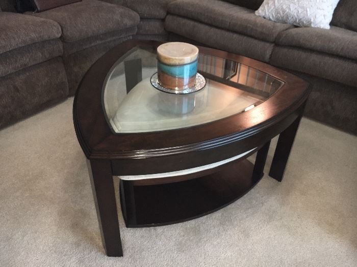 Cocktail table with pull-out ottoman.