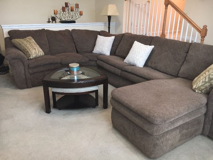 Lazy Boy sectional group consists of recliner on one end, corner section, sleeper section and chaise lounge on other end.
