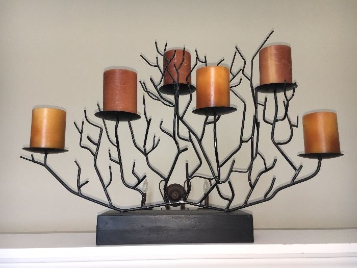 Contemporary sculptural metal candle holder.