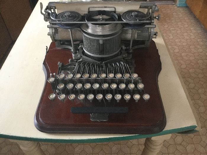 Antique Hammond typewriter with wood case. This will be on bid.