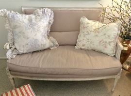 Louis XVI style Settee, glaze-washed finish with lumbar pillow; floral throw pillows