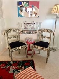 Accent furnishings; mirrored console table; Inlaid rams head side chairs; Painted metal stool; Crystal barware; Modern art by Daphne Spencer
