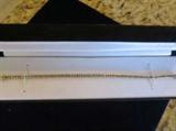 14K GOLD AND DIAMOND BRACELET..PAPERS INCLUDED