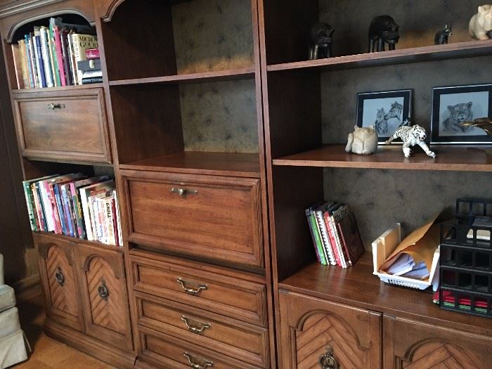 walnut wood entertainment center with drawers, cabinets and shelves