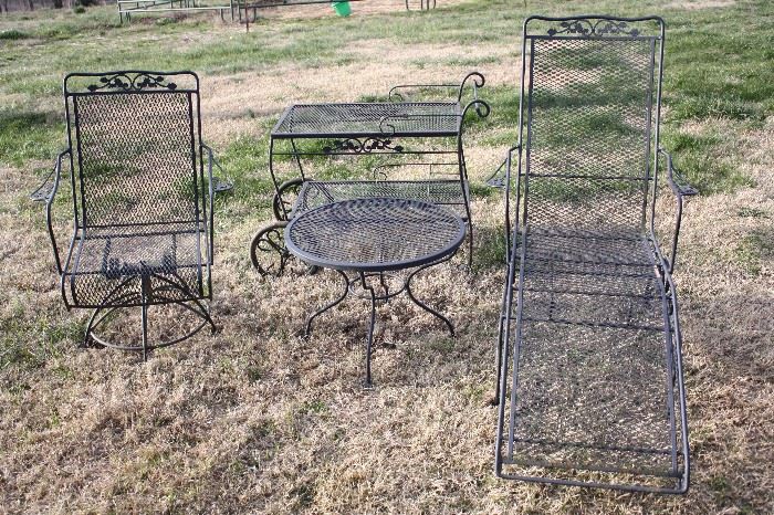 There are 8 pieces of quality wrought iron patio furniture