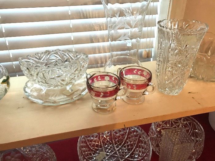 Crystal bowl, crystal vases, cranberry trim serving pieces.