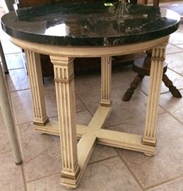 Round ionic column accent table with marble top.