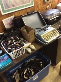Vintage typewriter, many sizes of cable tv cords and a/v cords for stereos, vcr's and dvd players