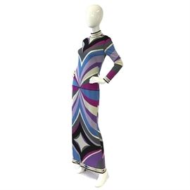 Circa 1960's Emilio Pucci Day-Night Maxi Dress: A circa 1960s Emilio Pucci day-night maxi dress. This gown features one of Emilio Pucci’s signature scarf-inspired prints in shades of purple, black, gray, magenta, periwinkle blue, and white. It includes a zip closure to the verso and is labeled by the designer.