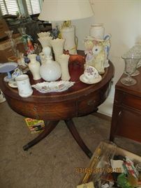 Vintage Drum table with leather inset top, Lenox vases, Belleek castle style lamp, Large vintage milk glass perfume and more