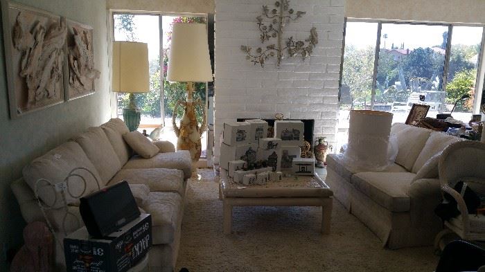 Sofa, love seat, cane wicker coffee table, southwestern bark art, large floor lamp, vintage metal chairs, stereo
