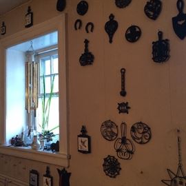 HUGE collection of cast iron trivets (check out the spider web!!!)