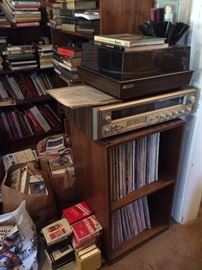 Vintage stereo equipment, 8-track player, record player, speakers, 8-track cassettes 