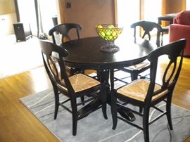 Kitchen table and four chairs, area rug