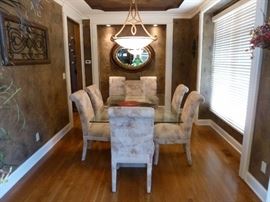 Glass top dining room table and 8 chairs