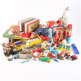 Howdy Doody Doll and Other Vintage Toys and Games: A collection of vintage toys and games. This collection includes a wide variety of plastic characters, metal cars, toy musical instruments, game boards and more. Featured items include one Feed the Elaphant! game, one Spin ’Em Target game, a Plastic Spelling and Counting Board, one toy accordion, a Howdy-Doody blow up doll and more. The paper mâché rabbit with basket is marked “To: Dennis, From: Grandma, 1949,” on the bottom underside.