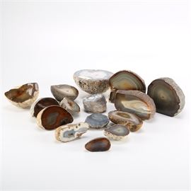 Agate Mineral Collection: A collection of agate minerals. This collection contains fifteen specimens of various color pallets that were extracted from various locations. Tags are present on a few specimens that mark their name and origin.