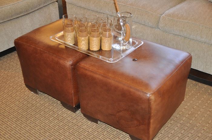 A pair of distressed brown leather ottomans (20" sq.)!