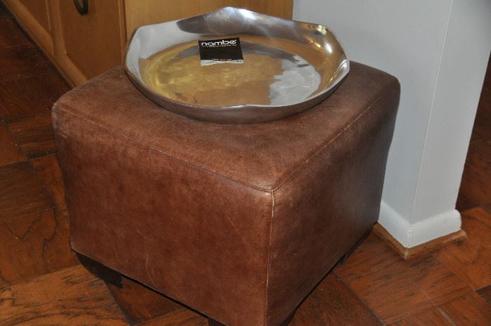 Another brown distressed leather ottoman (shown with a new oversized Nambe platter)