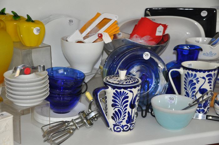 Great vintage items including cobalt blue glassware, Mexican pottery, Blenko pitchers and a small light blue Pyrex mixing bowl 