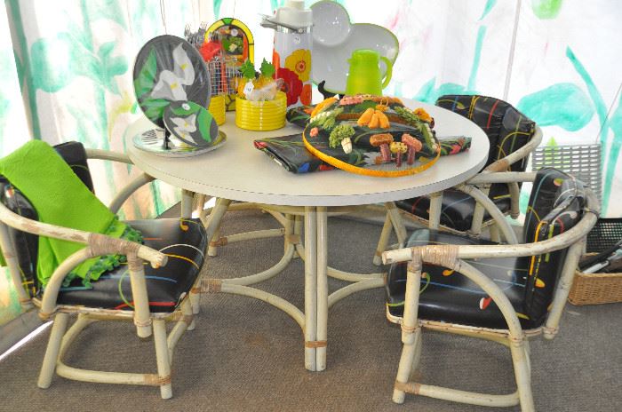 Vintage 4' formica top and bamboo base patio table and 4 chairs! Also shown are vintage Heller yellow plates!