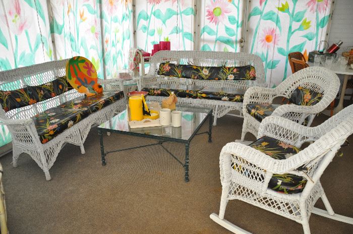 Vintage wicker patio furniture sold as two sets including a 6' sofa and rocker