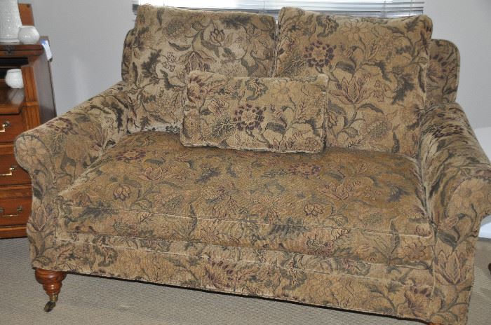 Gorgeous high-end loveseat made exclusively for Grange with carmel colored leather sides