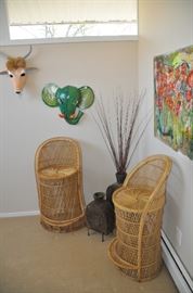 Great mid century wicker chairs shown with paper mache animal masks